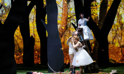 Così fan Tutte in San Diego Cupid (Jack Missett) embraces Friodiligi (soprano Sarah Tucjer) while Despina (soprano Alisa Jordheim) looks on from above in San Diego Opera's COSI FAN TUTTE. Photo by Karli Cadel.